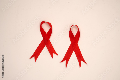 World aids day, red silk ribbon symbol of AIDS Awarenesss photo