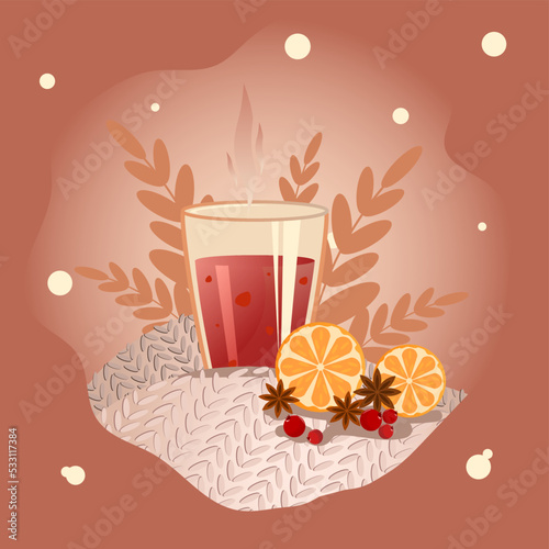 Gluhwein in a glass, standing on a plaid, with orange and leaves on a dark background