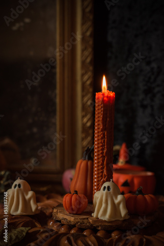 Candle burns on the altar, powerful magic among candles, energy cleaning and wicca concept	 photo