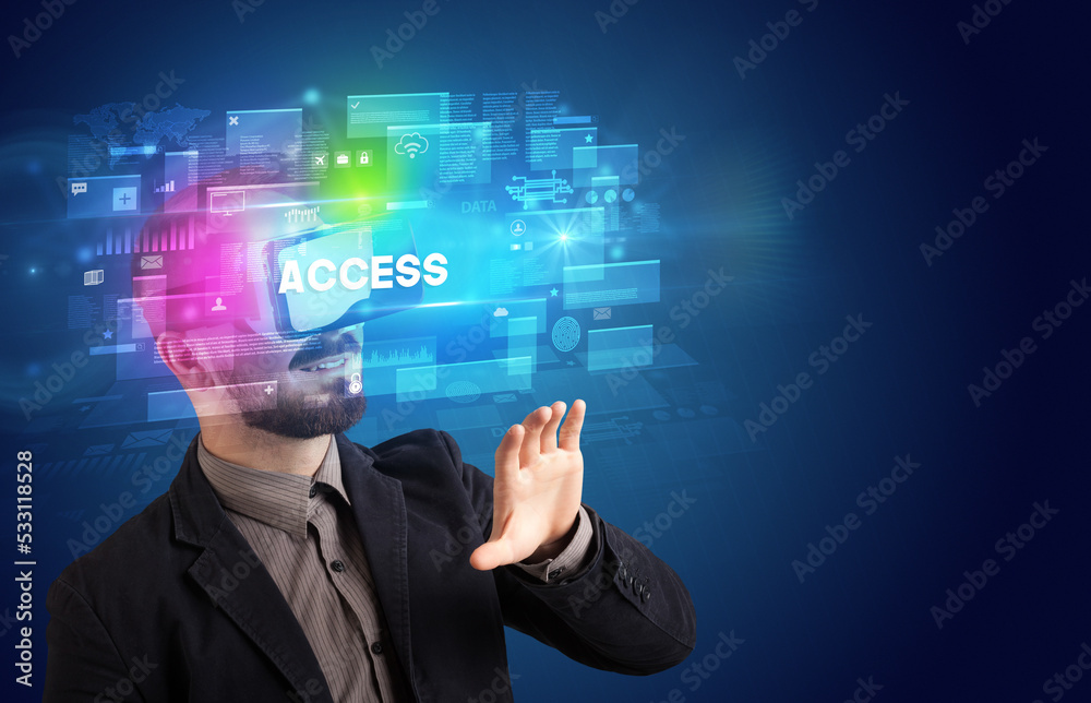 Businessman looking through Virtual Reality glasses Businessman looking through Virtual Reality glasses