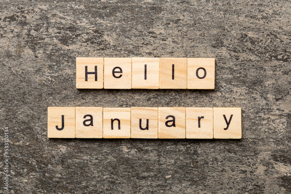 Fototapeta premium hello january word written on wood block. hello january text on table, concept