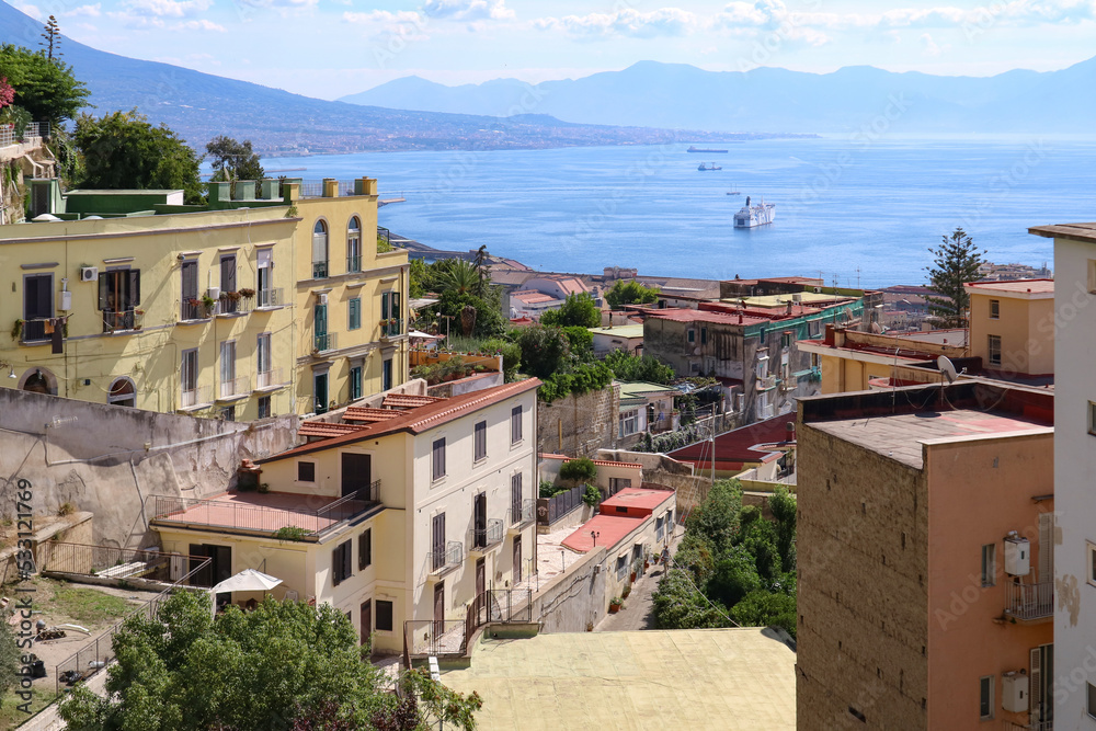 Panoramic view from above of the old town overlooking the sea in Naples, Italy.