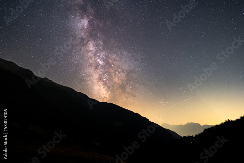 Milky way above the mountains and the trees. nightscape with the milky way