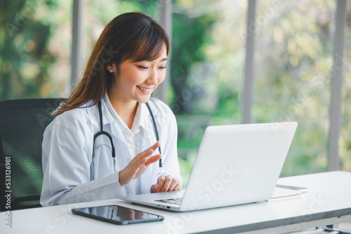 Doctor using online health consulting on computer pc and digital tablet, Tele medical healthcare concept