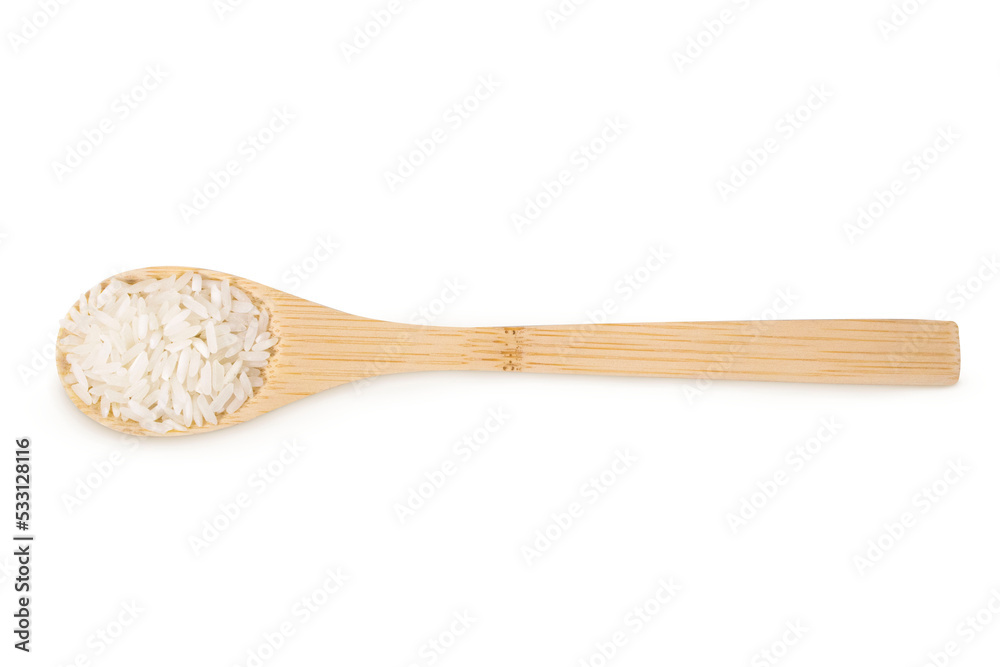 Rice on an isolated white background. Rice in a wooden spoon. Rice on an isolated white background. Rice in a wooden spoon.