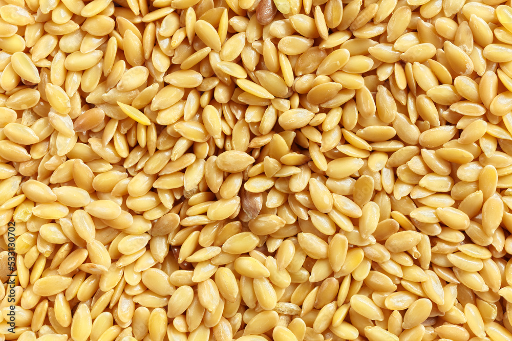 Close up picture of golden flaxseeds, selective focus. Close up picture of golden flaxseeds, selective focus.