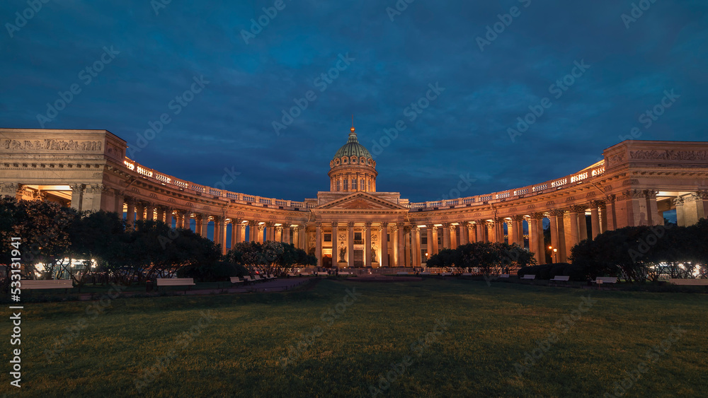 A park in front of the Kazan Cathedral against the sky at summer night