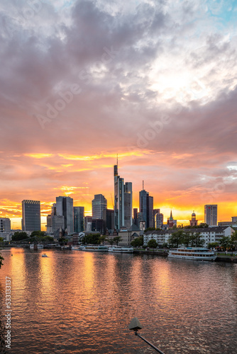 Sunset on the Mein river with a skyline in the background. Romantic city shot of Frankfurt  Hessen  Germany