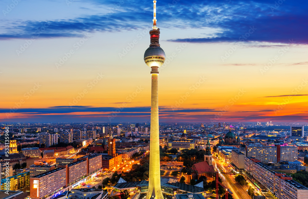 Aerial downtown panorama of Berlin at night with the skyscrappers and the bridges, Germany