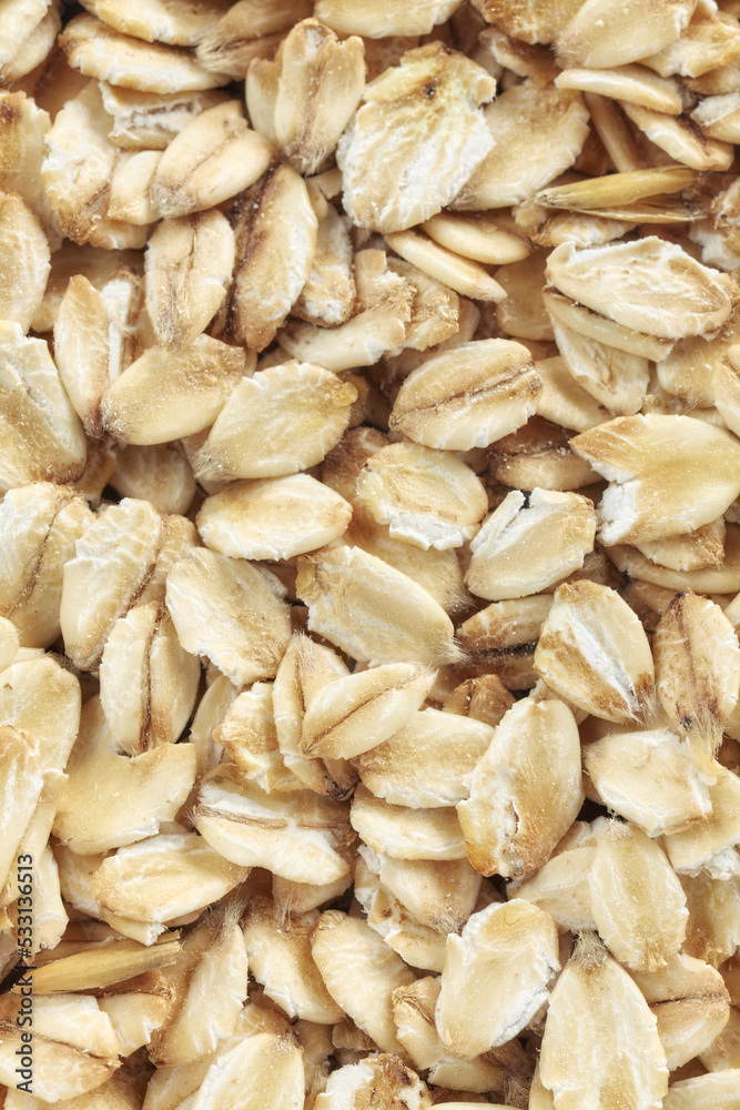 Close up picture of thick rolled oats, selective focus. Close up picture of thick rolled oats, selective focus.