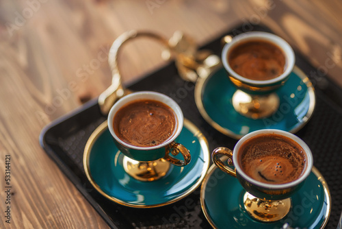 freshly brewed hot turkish coffee on the table. treating customers with coffee in the office for the sale of apartments in Turkey. black strong coffee in istanbul