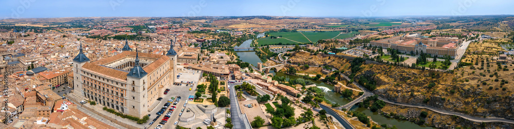 A panoramic aerial view of Toledo with the Alcazar fortress, Tagus River, and Infantry Academy