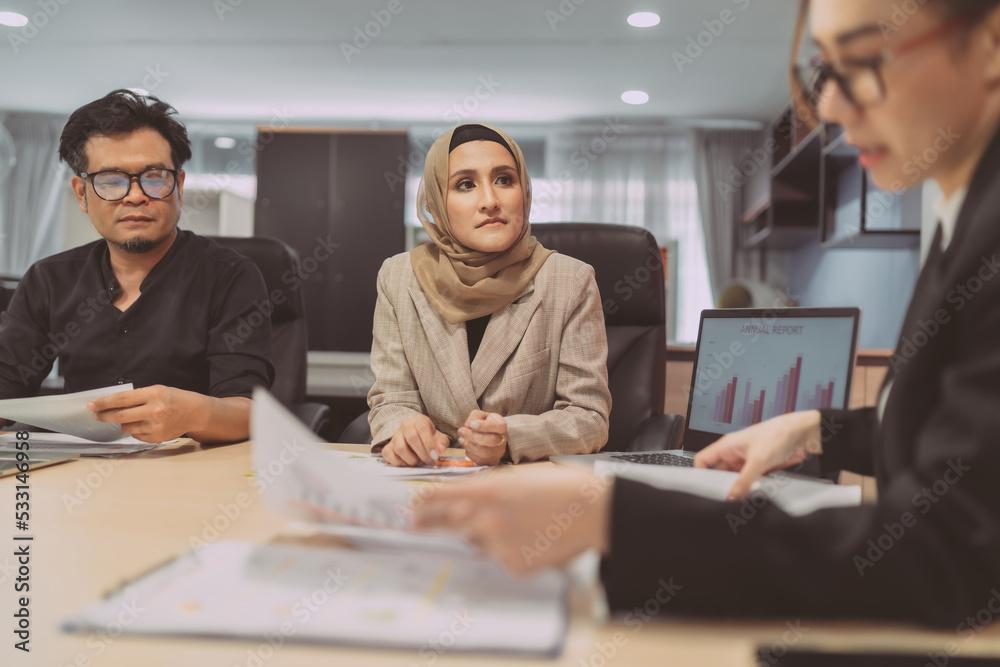 business muslim and asian woman and man have meeting. group of professional office working having meeting present talking about organization. international worker in conference onsite planning work business muslim and asian woman and man have meeting. group of professional office working having meeting present talking about organization. international worker in conference onsite planning work