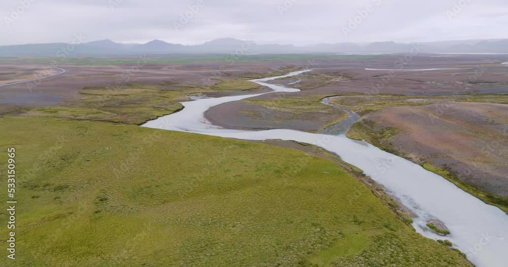 Aerial view, flying sidewards, of winding river Sanda in the desolate highlands of Iceland. Aerial view, flying sidewards, of winding river Sanda in the desolate highlands of Iceland.