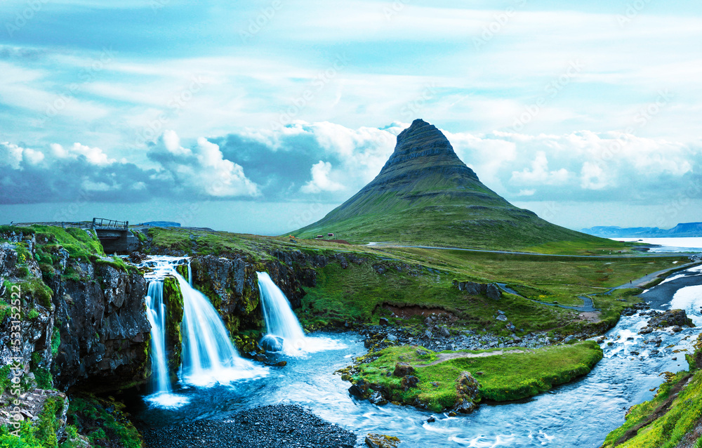 Beautiful natural magical scenery with a waterfall Kirkjufell near the volcano in Iceland. Exotic countries. Amazing places. Popular tourist atraction. (Meditation, antistress - concept).