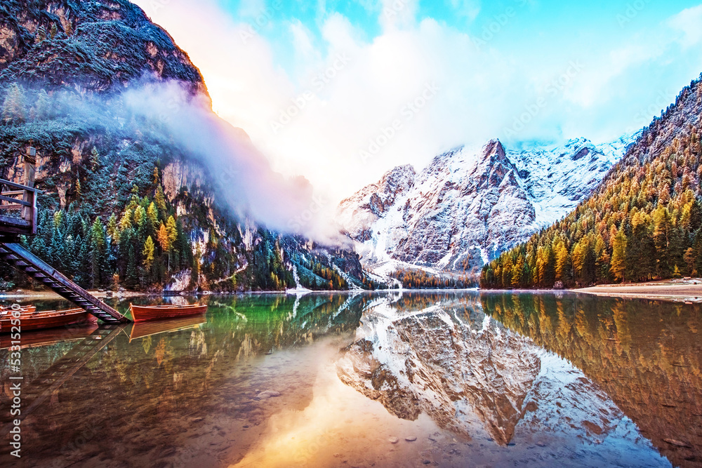 Magical autumn landscape with boats on the lake on Fanes-Sennes-Braies natural park in the Dolomites in South Tyrol, Alps, Italy. (mental vacation, holiday, inner peace, harmony - concept)