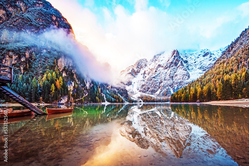 Obraz na płótnie Magical autumn landscape with boats on the lake on Fanes-Sennes-Braies natural park in the Dolomites in South Tyrol, Alps, Italy. (mental vacation, holiday, inner peace, harmony - concept) w salonie