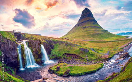 Obraz na płótnie Beautiful natural magical scenery with a waterfall Kirkjufell near the volcano at dawn in Iceland. Exotic countries. Amazing places. Popular tourist atraction. (Meditation, antistress - concept). w salonie