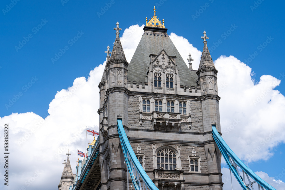 Tower Bridge Tower closeup with puffy clouds behind