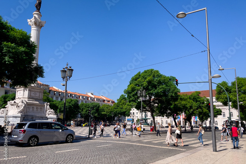  People walking nearby Rossio square in Lisbon 