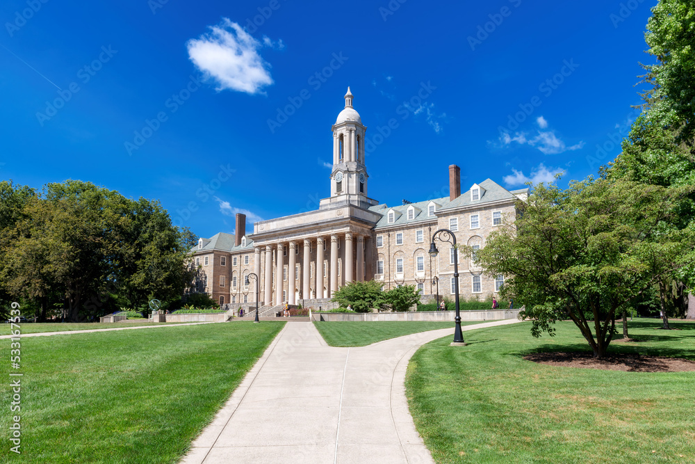 The Old Main building on the campus of Penn State University in spring sunny day, State College, Pennsylvania.