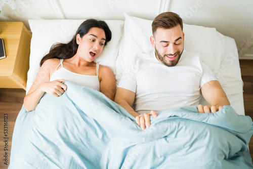 Excited couple feeling happy about having sex