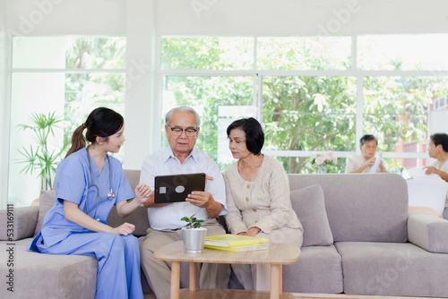 Nursing Home Care concept. The staff explained to the elderly who signed a medical treatment contract, a nursing home service agreement form.