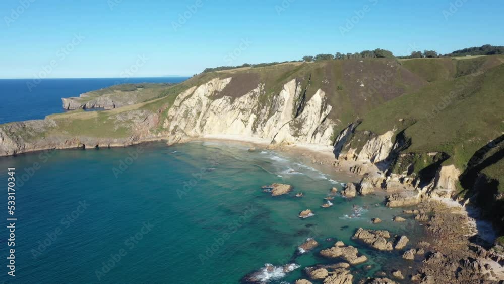 Aerial view of the sea and cliffs at El Oso Beach and La Franca Beach, La Franca, Asturias, Costa Verde, Spain. Aerial view of the sea and cliffs at El Oso Beach and La Franca Beach, La Franca, Asturias, Costa Verde, Spain.