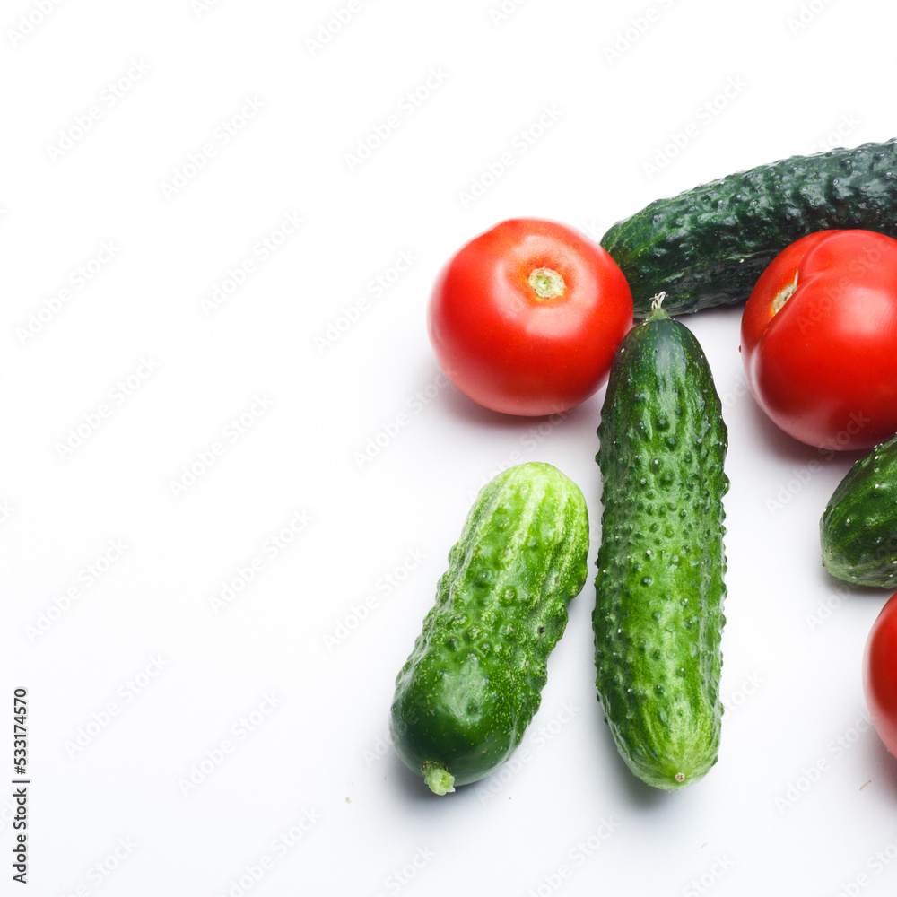 vegetables tomatoes and cucumbers on a white background studio photo vegetables tomatoes and cucumbers on a white background studio photo