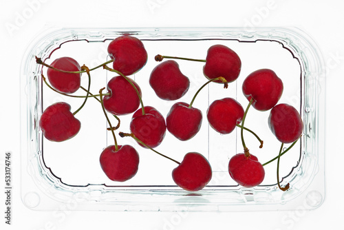 cherries in transparent plastic container