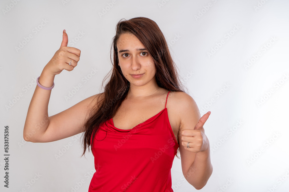 Woman posing on isolated white background, selective focus shot. Woman posing on isolated white background, selective focus shot.