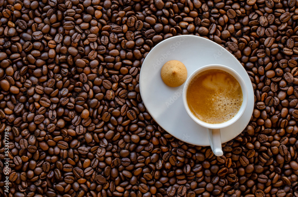 Cup of coffee and coffee beans on table, top view Cup of coffee and coffee beans on table, top view
