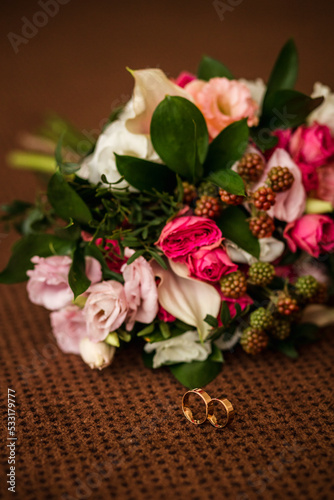 gold wedding rings, bridal bouquet with pink flowers, details, bridal fees © Shkriabii