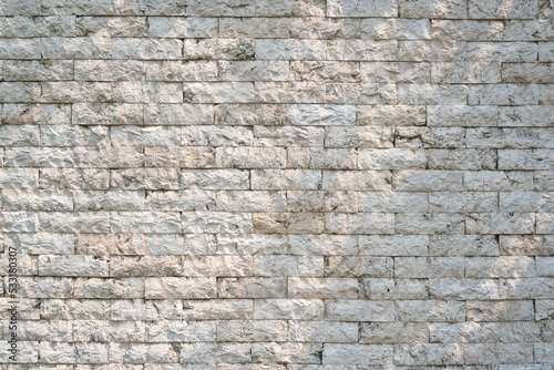 White grunge brick wall with sunlight for Texture and background