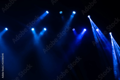 Blue lights and smoke on stage in the concert