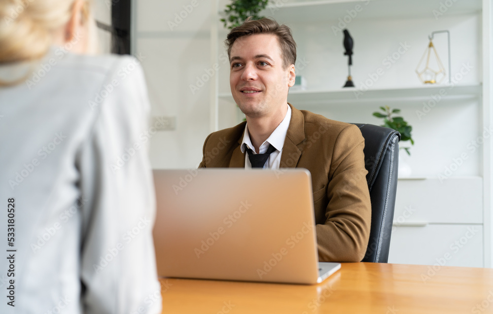 Businessman manager using laptop asking candidate questions new employee businesswoman during interview at office