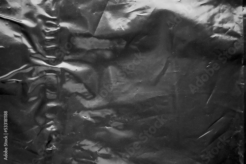 transparent plastic bag film wrap overlay texture on black background