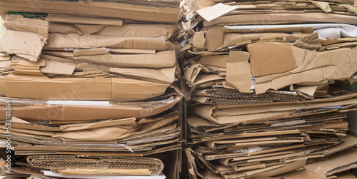 Two packages made of recyclable brown cardboard ready for transport to the paper mill
