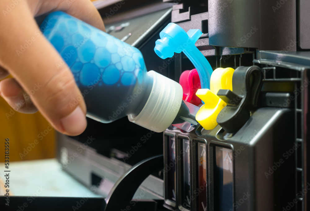Refilling ink into a ink tank printer at office Refilling ink into a ink tank printer at office
