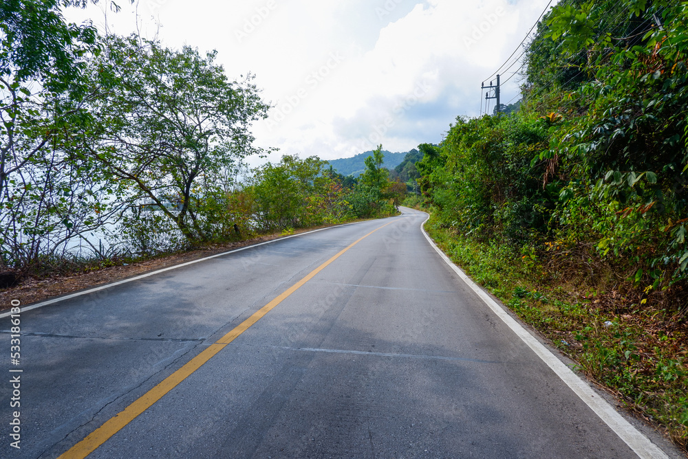 Beautiful Empty asphalt road with mountain and sea in Thailand