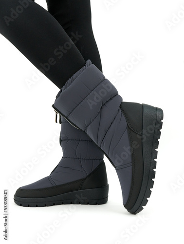legs in gray shoes isolated on white background
