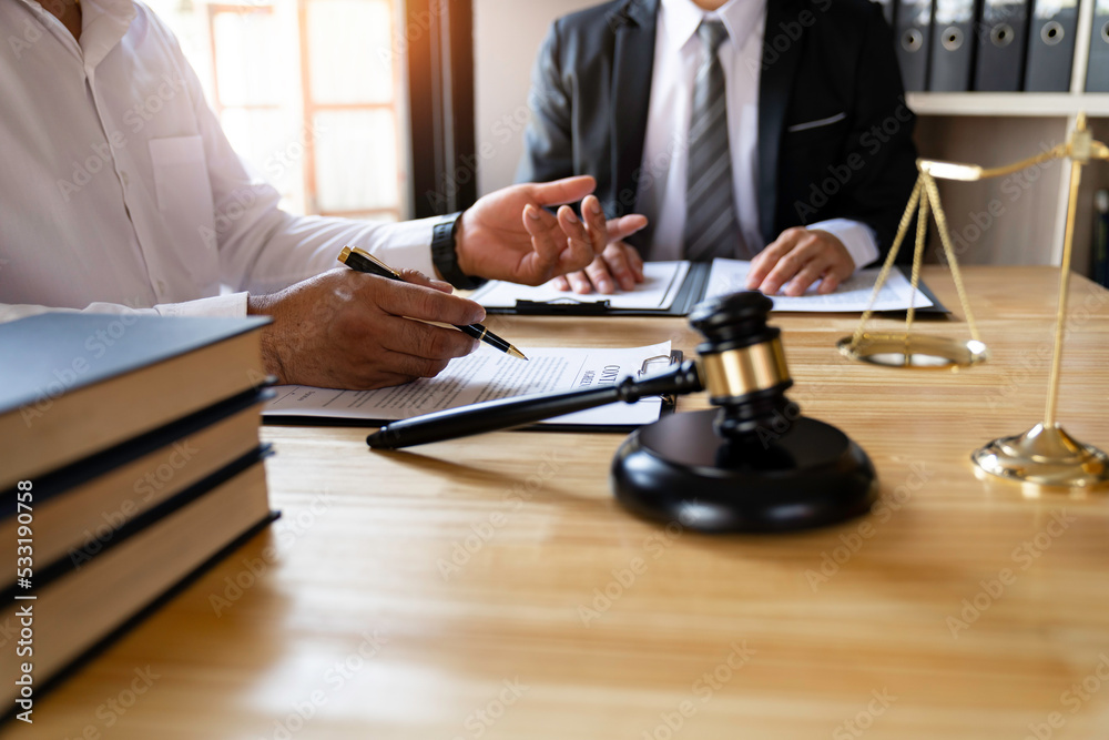 Attorneys or lawyers who are reading the statute of limitations Consultation between male lawyers and business clients, tax and legal and legal services firms....
