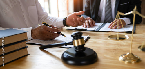 Attorneys or lawyers who are reading the statute of limitations Consultation between male lawyers and business clients, tax and legal and legal services firms....