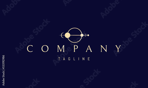 Vector golden logo on which an abstract image of the solar system in a geometric style.