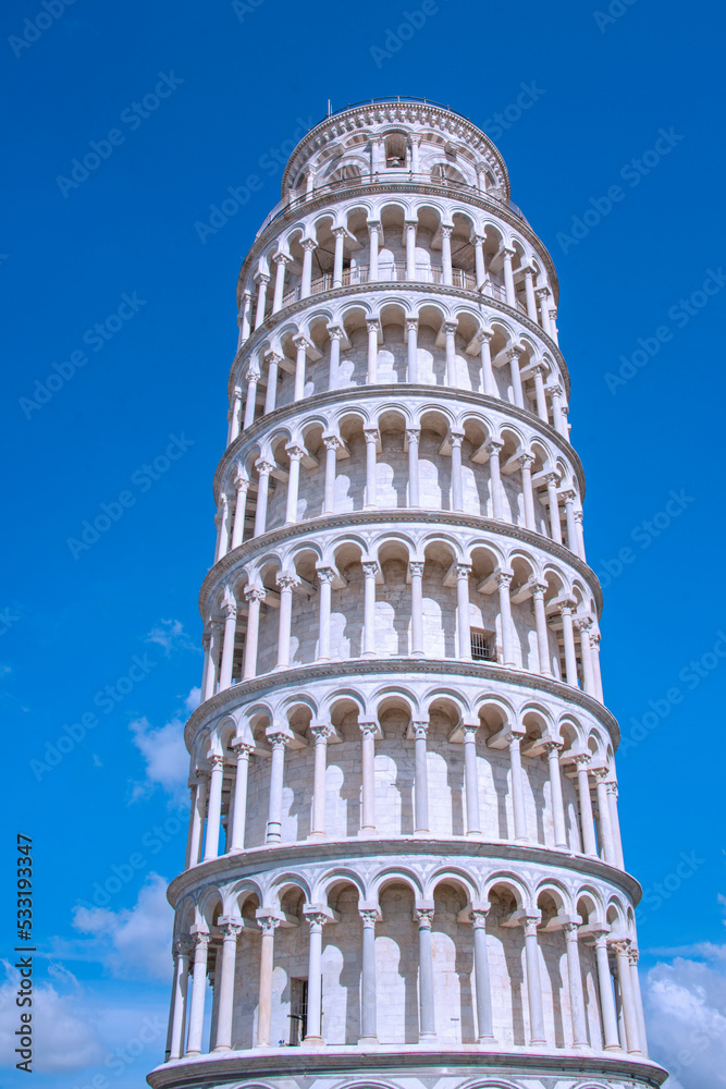 The Leaning Tower of Pisa  is a medieval structure, famous for the settling of its foundations, which caused it to lean 5.5 degrees The bell tower was built in 1173 in white marble, Italy, 2019