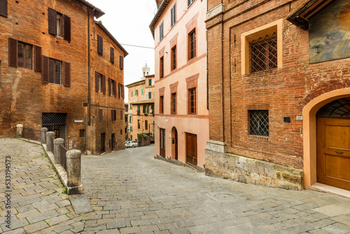 Fototapeta Naklejka Na Ścianę i Meble -  The historical center of Siena, the UNESCO World Heritage Centre, unchanged for 13-14 centuries, with its medieval streets looked like in the early Middle Ages. Italy, 2019

