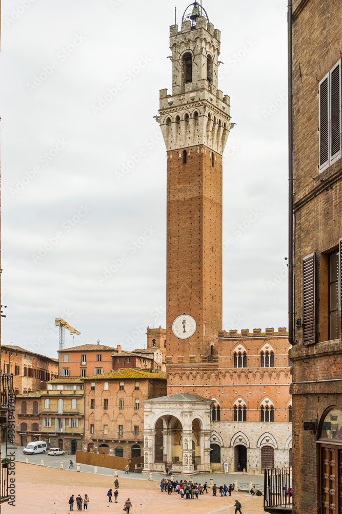 The Palazzo Pubblico (town hall) was built 1325 and it was to house the republican government. The outside of the structure is an example of Gothic Italian medieval architecture. Siena, Italy, 2019