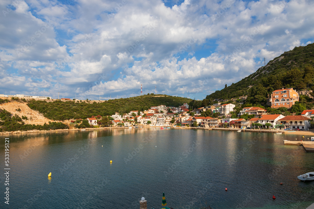 Seaside landscape in Uvala-Duboka in Croatia. Sea, mountains and blue sky with clouds in the background.