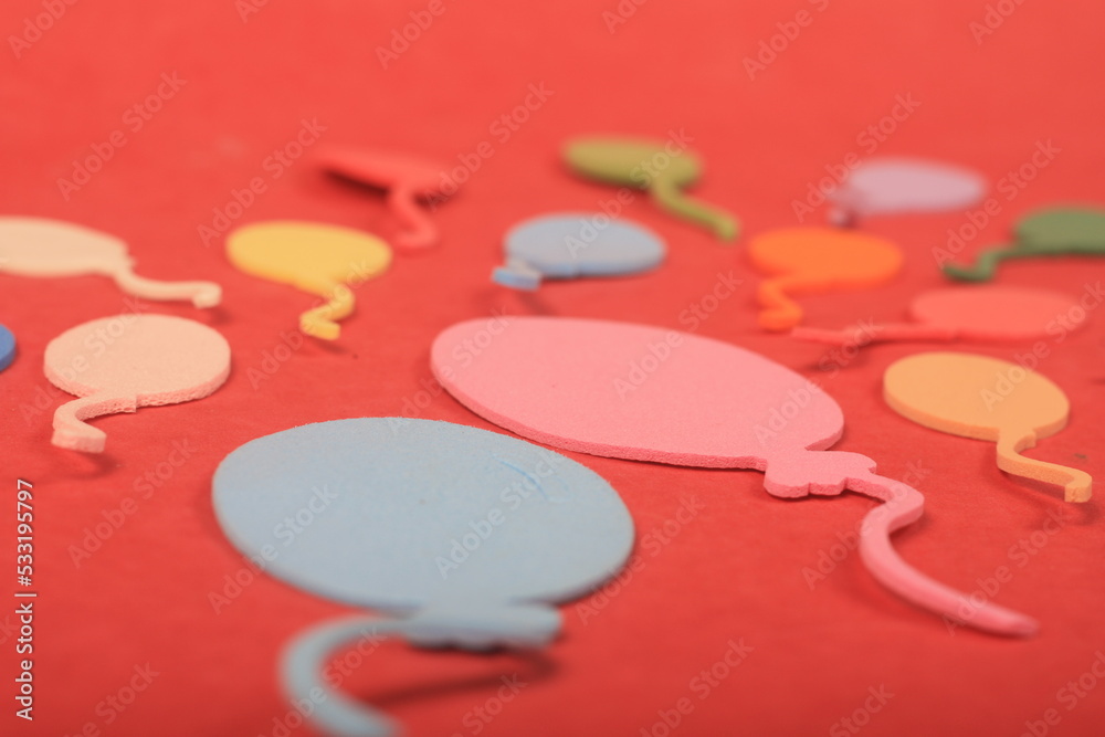 colorful balloons on red background
colorful balloons on red background