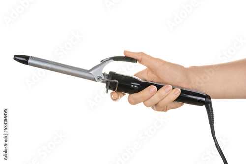 A woman's hand holds an electric curl for winding curls. Professional hairstyling tool. Isolated on white background